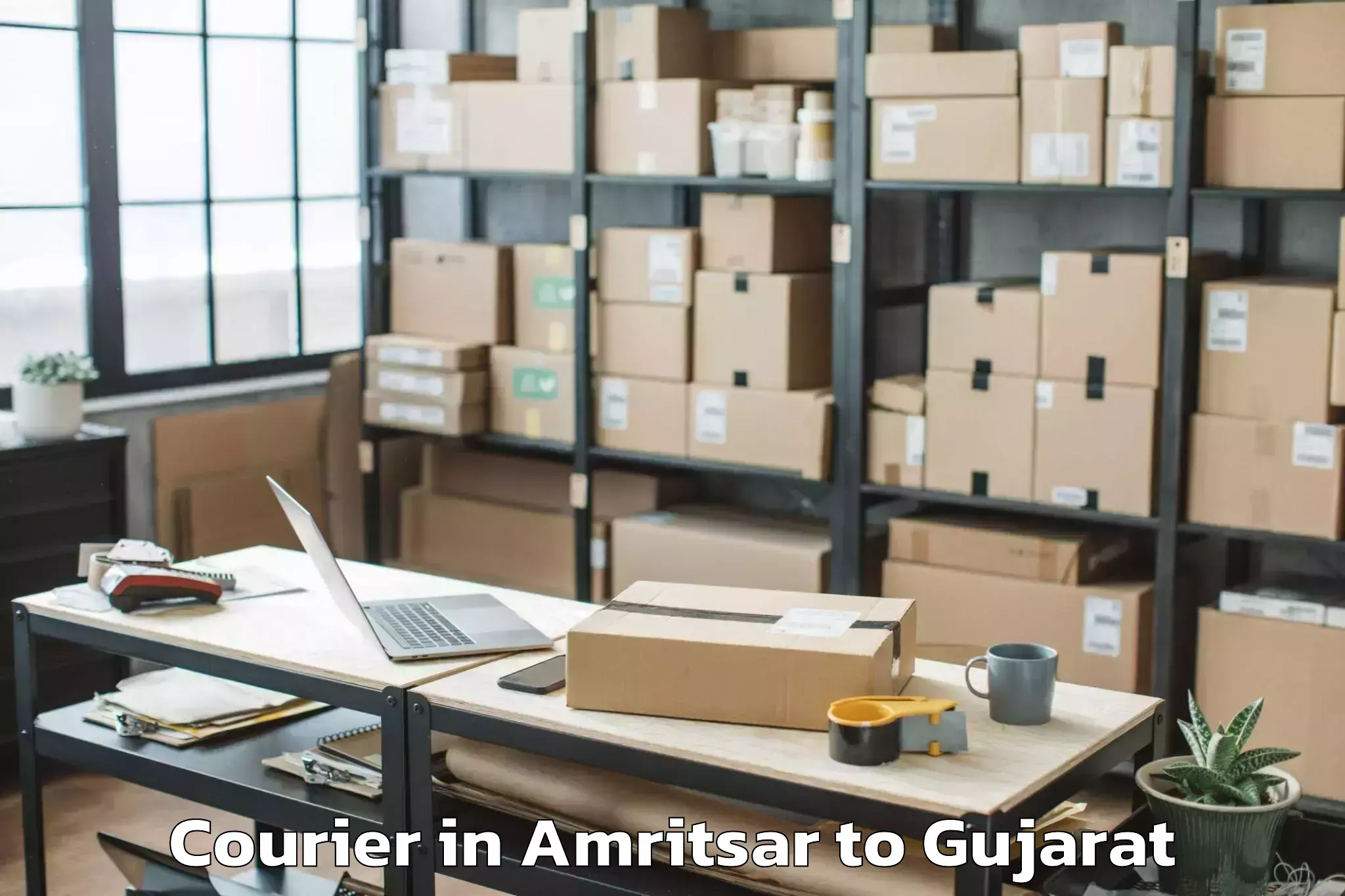 Book Amritsar to Navrangpura Courier Online